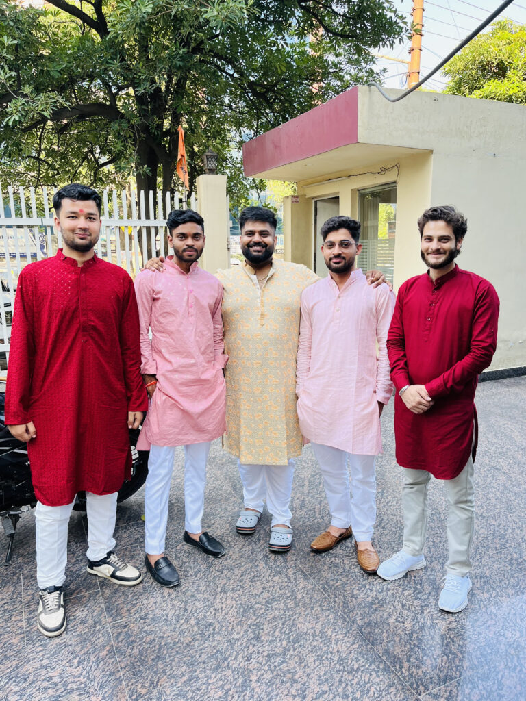 Team of probey services wearing traditional dress at Diwali event .