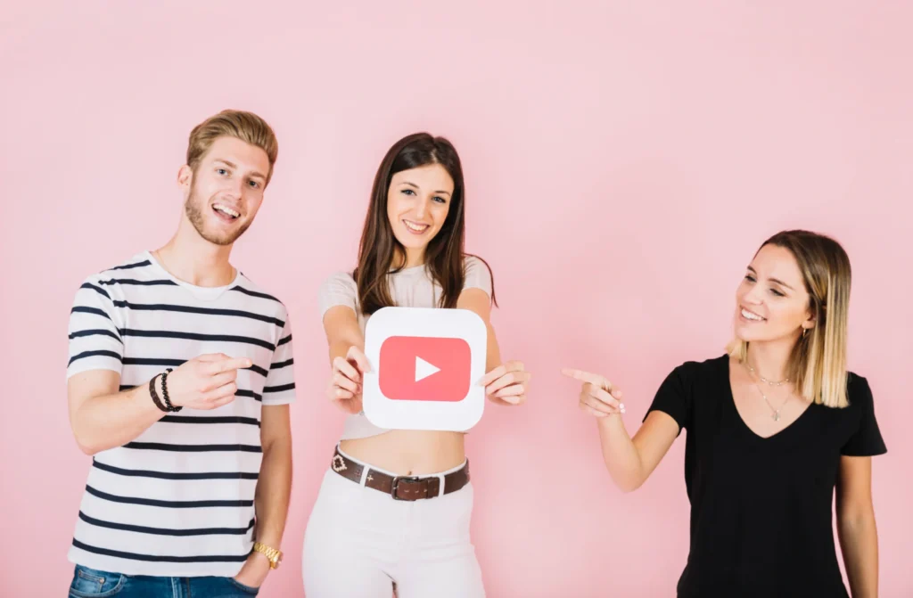 happy-man-woman-pointing-their-friend-showing-play-icon